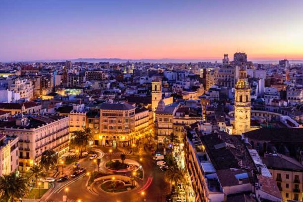 Sightseeing of Spain. Aerial view of Valencia at sunset. Illumin