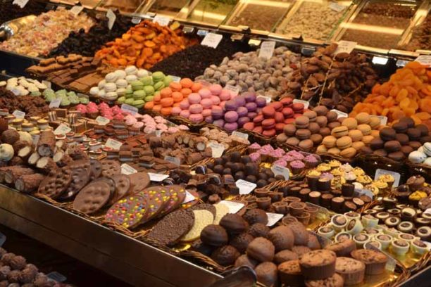 Sweet and chocolate stall in the food market in Barcelona, Spain