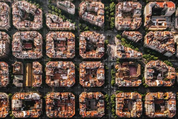 Aerial view of typical buildings of Barcelona cityscape from helicopter. top view, Eixample residencial famous urban grid